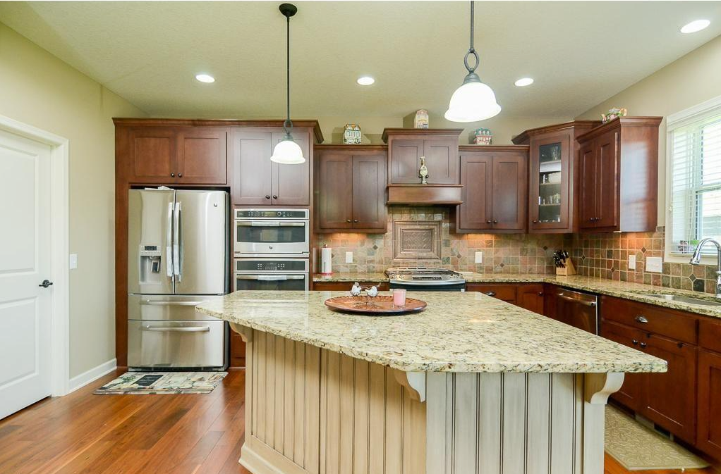 Updated kitchen with granite island in a District 196 home